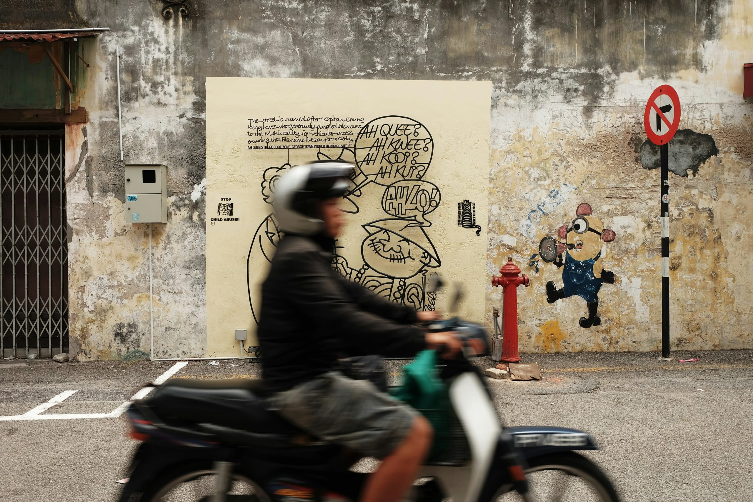 A woman smiling while riding an e-bike through vibrant Lisbon streets