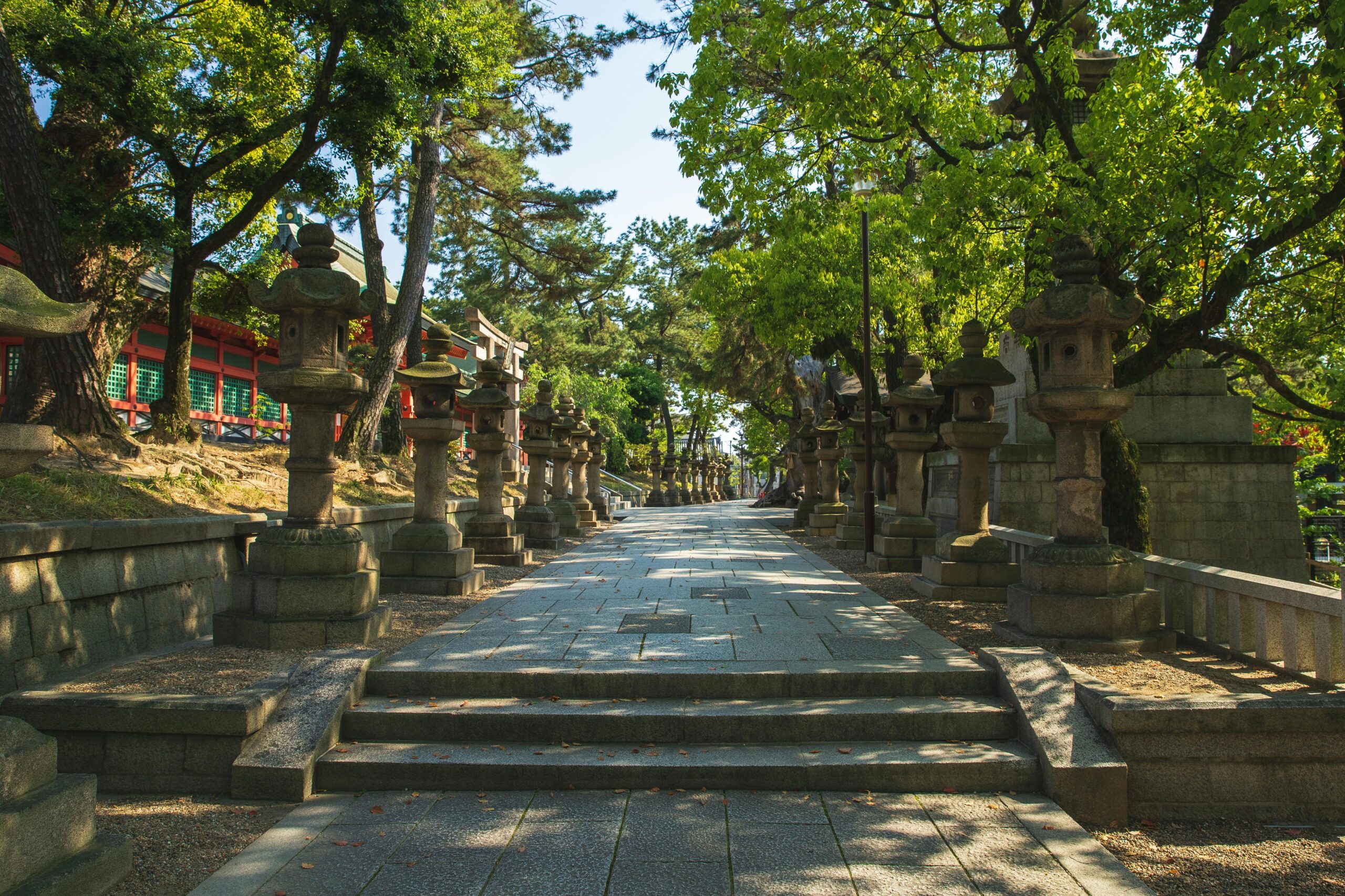 E-bikers navigating narrow paths between ancient shrines