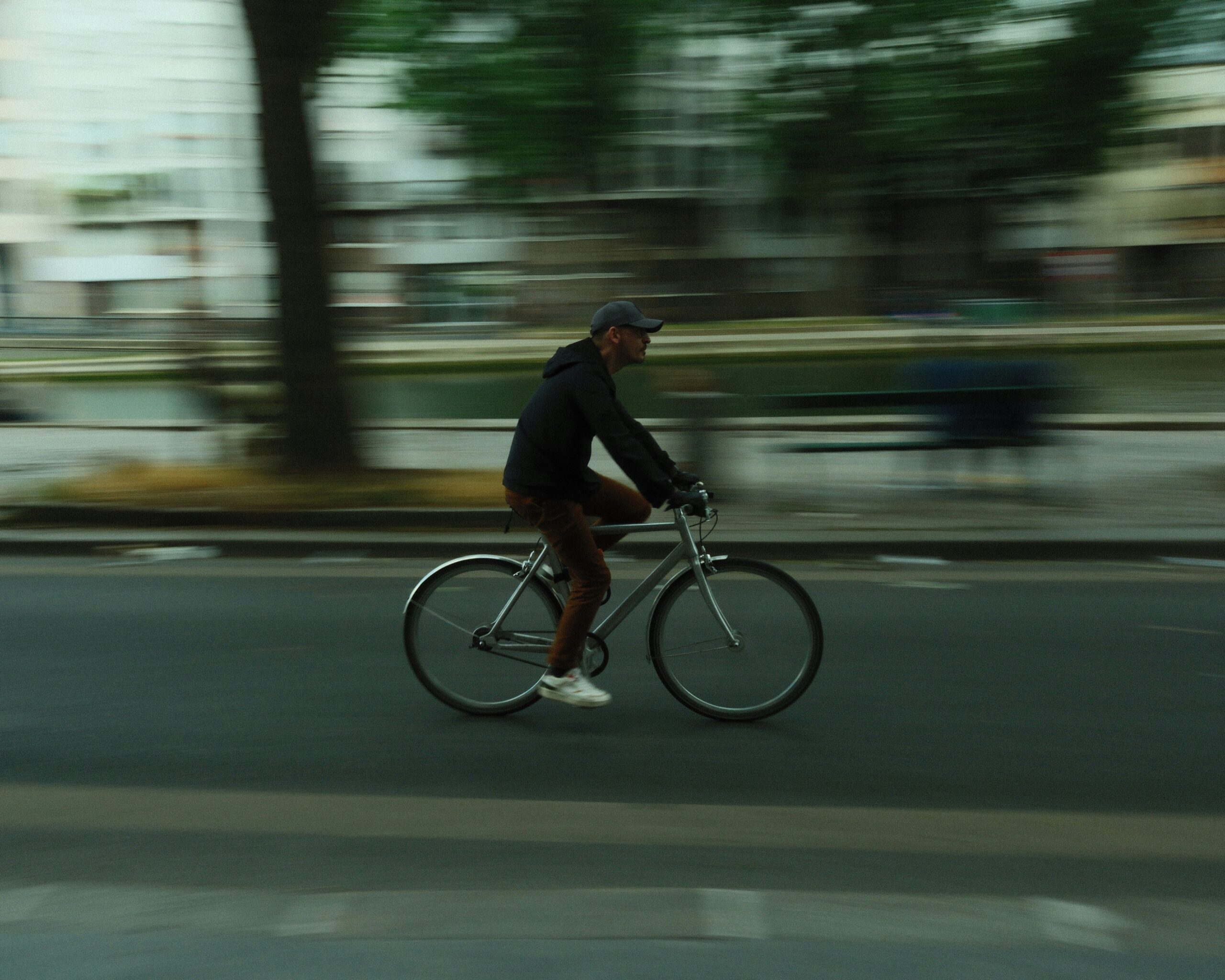 Cyclist using hand signals to communicate with drivers in the city