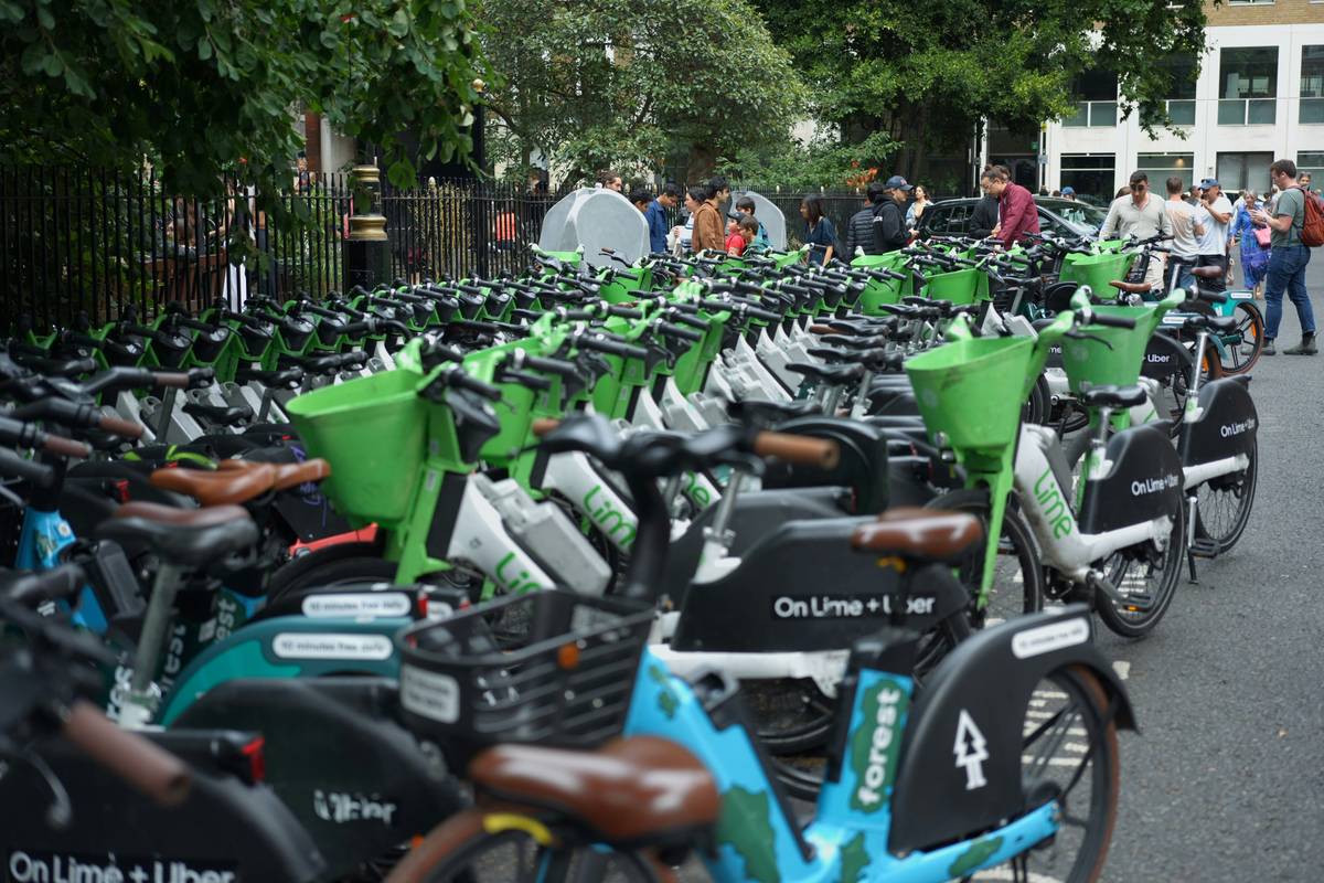 A backpack packed with essentials including a water bottle, map, and sunscreen