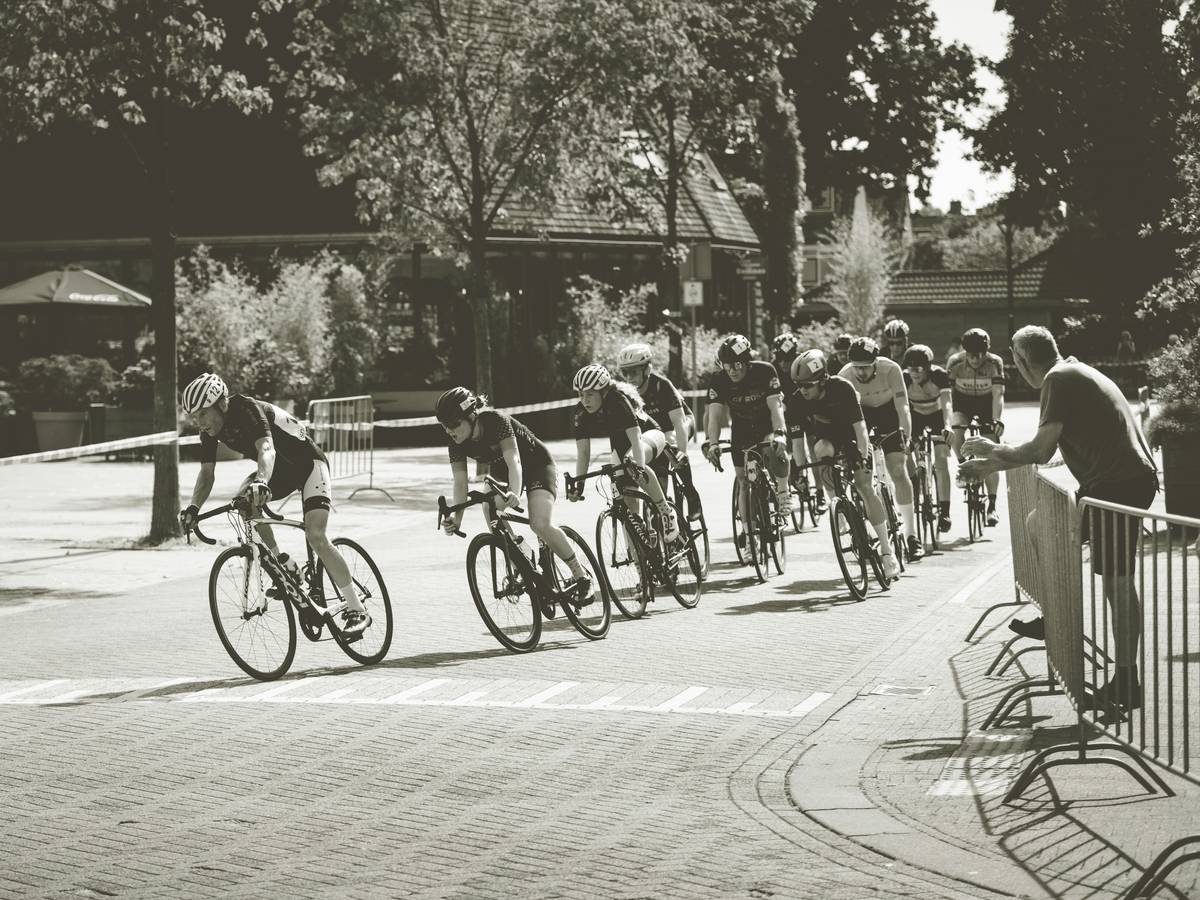 A cyclist riding an urban ebike past iconic city landmarks