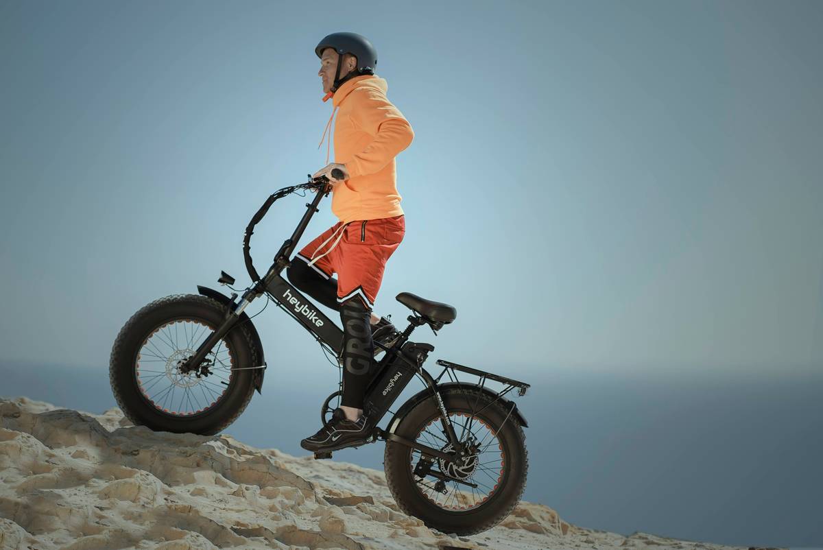 Woman smiling after completing an eco bike route along the Oregon Coast