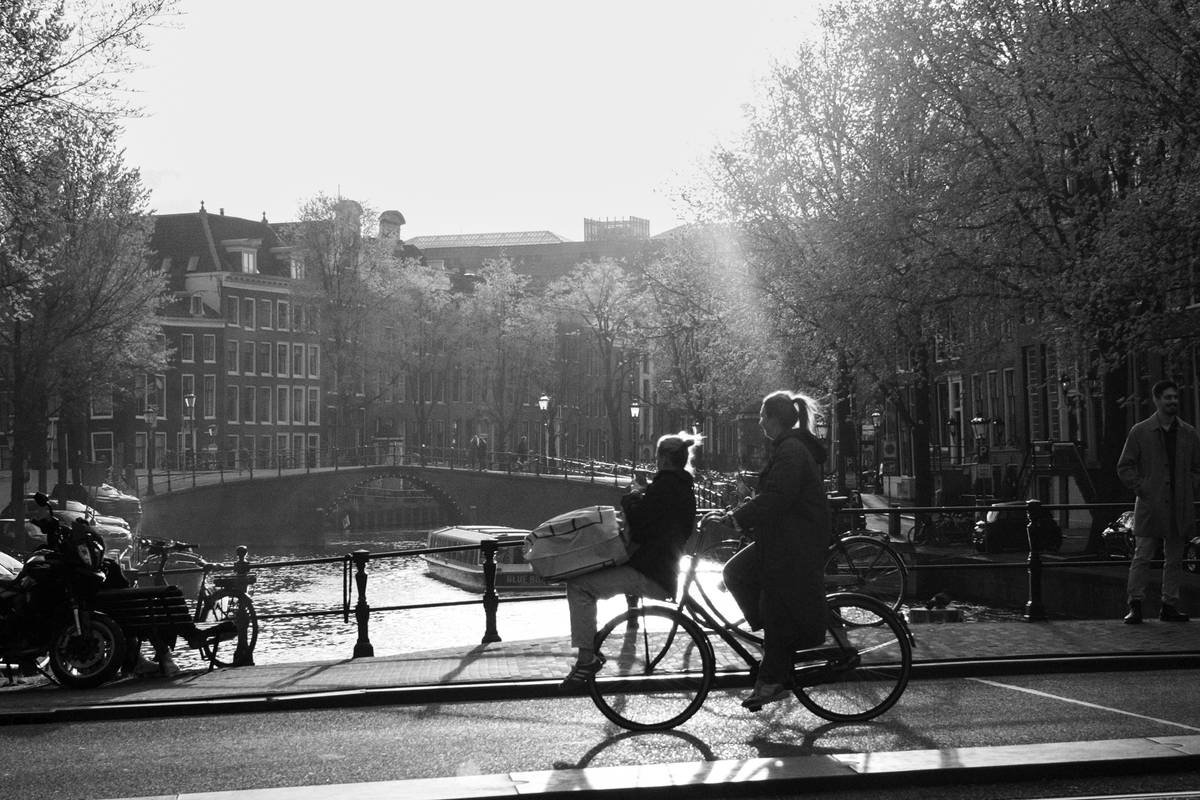 Group of tourists riding electric bikes in a vibrant cityscape